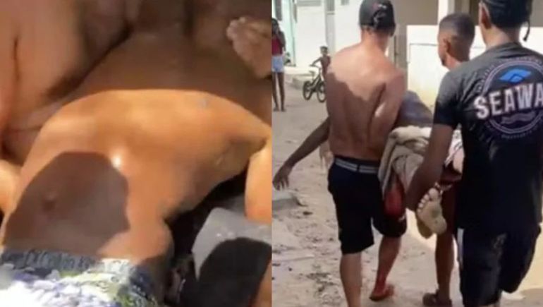 La víctima es llevada por otros jóvenes tras ser atacado mortalmente por un tiburón en una playa del noreste de Brasil