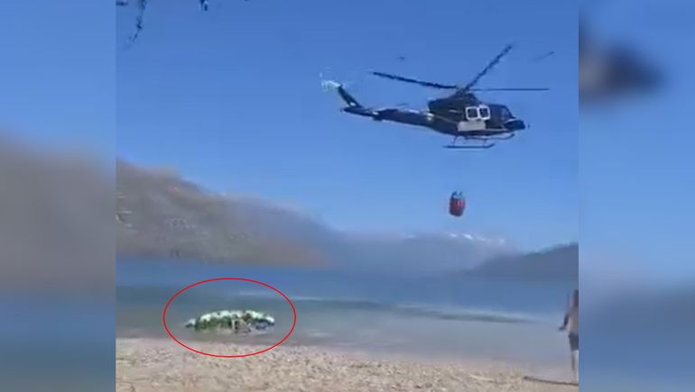 Susto en Lago Puelo: un kayakista volcó tras una maniobra de un helicóptero hidrante en plena emergencia