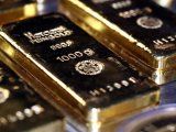 FILE PHOTO: Gold bars and coins are stacked in the safe deposit boxes room of the Pro Aurum gold house in Munich, Germany,  August 14, 2019. REUTERS/Michael Dalder/File Photo