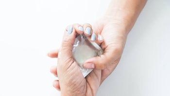 condom-in-male-hand-and-female-hand-give-condom-safe-sex-concept-on-white-background (1).jpg