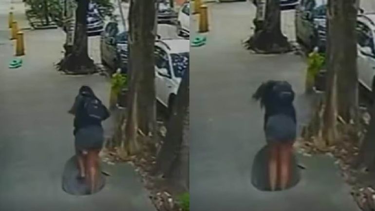 El momento en que una mujer cayó en una alcantarilla en el barrio Maracaná en Río de Janeiro. El momento en que una mujer cayó en una alcantarilla en el barrio Maracaná en Río de Janeiro.