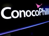FILE PHOTO: The logo for ConocoPhillips is displayed on a screen on the floor at the New York Stock Exchange (NYSE) in New York, U.S., January 13, 2020. REUTERS/Brendan McDermid/File Photo