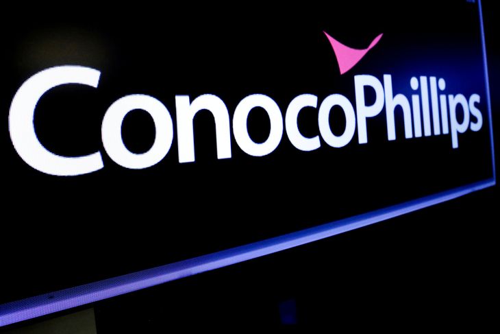 FILE PHOTO: The logo for ConocoPhillips is displayed on a screen on the floor at the New York Stock Exchange (NYSE) in New York