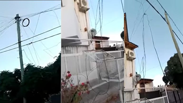 Vecinos denuncian que un poste con cables está a punto de caerse
