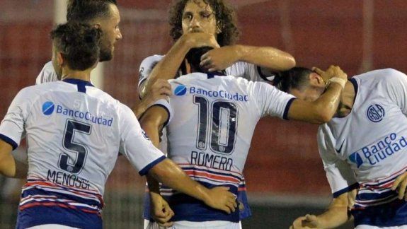 Coloccini con uno de los Romero.