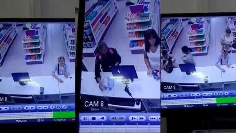 Una policía robó el celular a una clienta de una farmacia