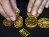 Monedas y barras de oro exhibidas en Londres. REUTERS/Neil Hall